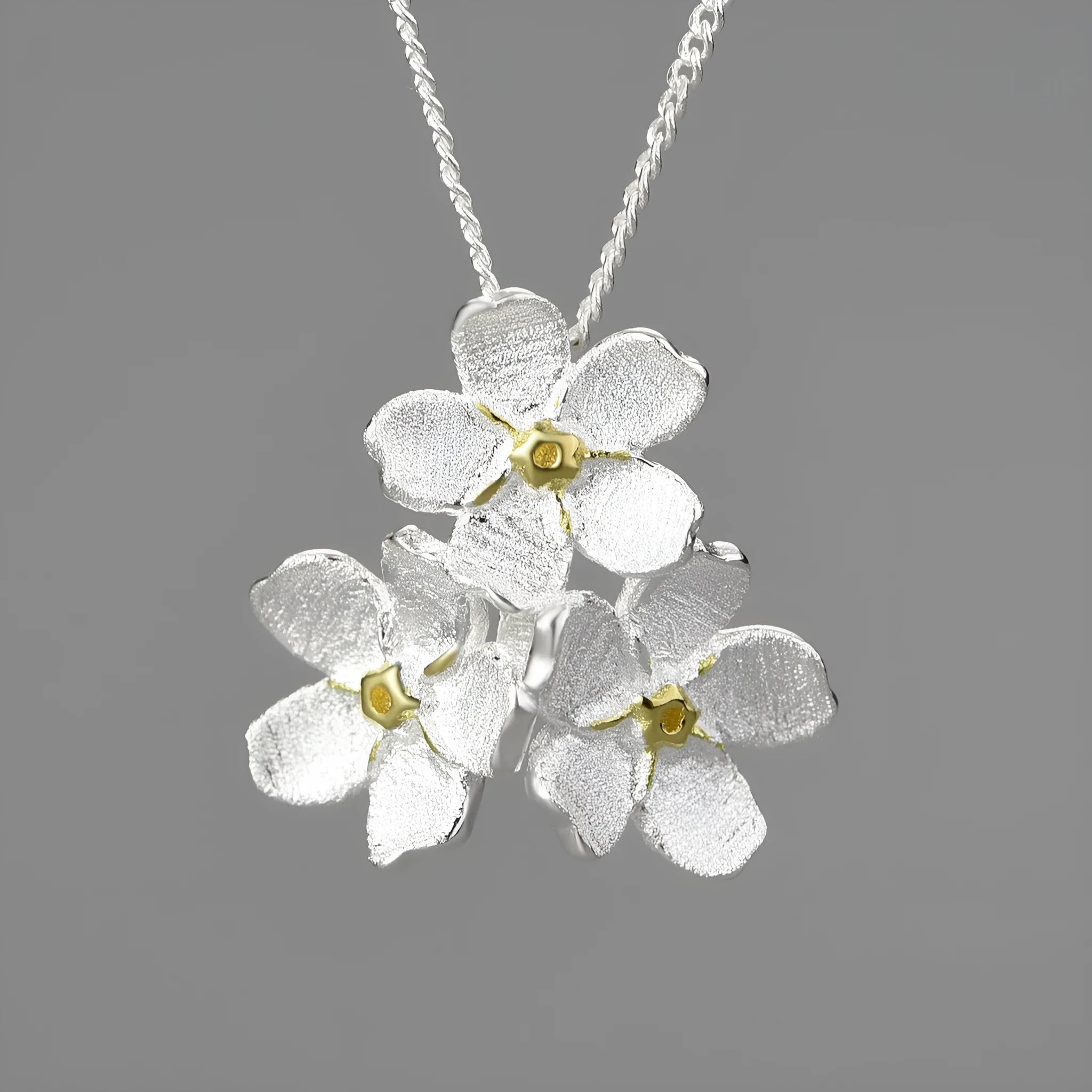 Sterling silver forget-me-not flower pendant in pastoral style with electroplated finish