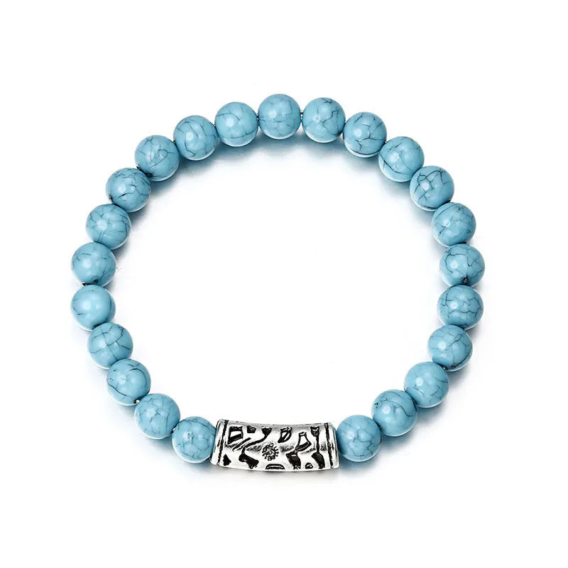 Classic acrylic blue beaded bracelet on stretch cord on a light background