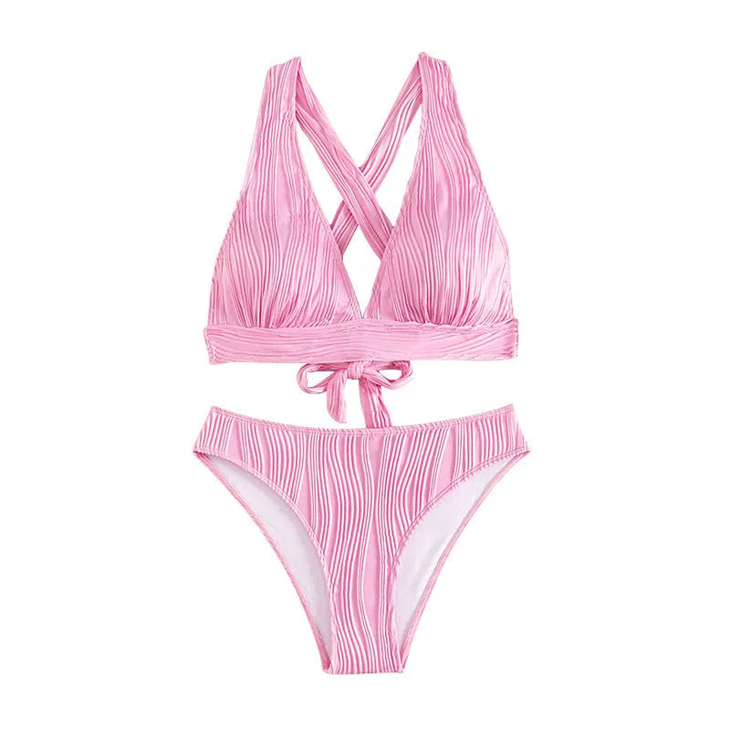 Pink and black women's halter neck bikini set with swim shorts on a mannequin.
