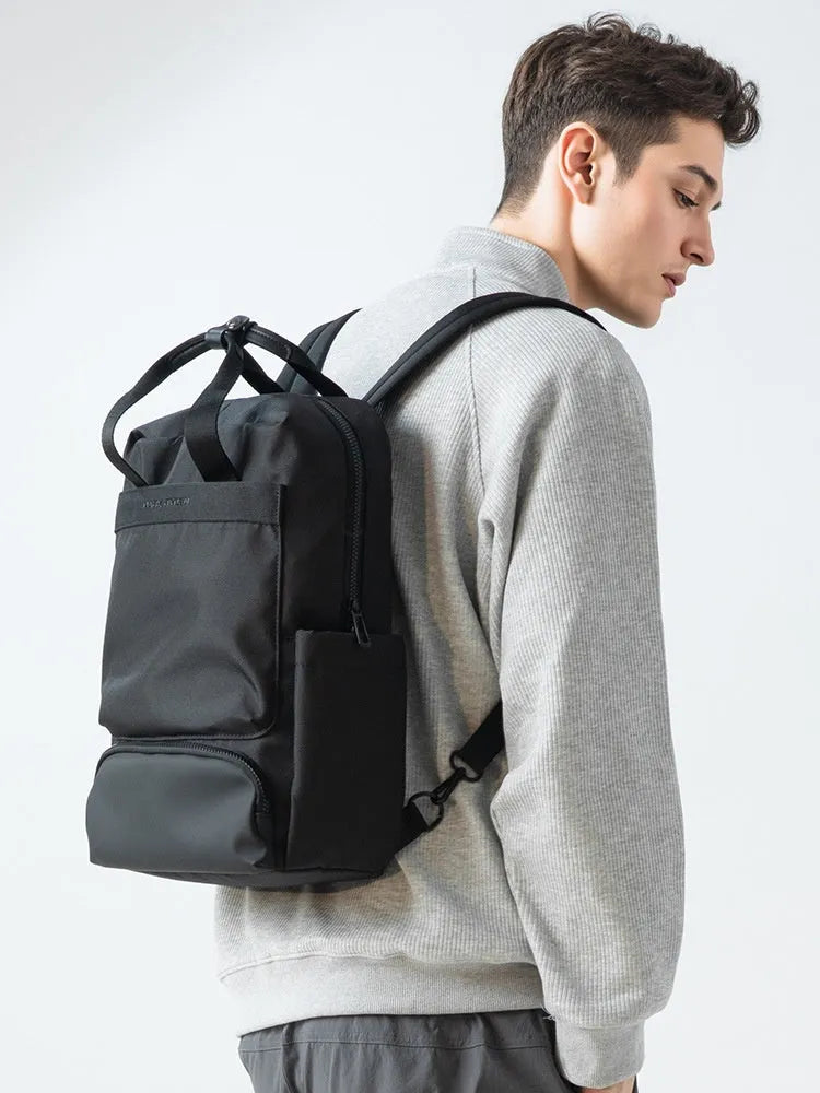 Black Oxford cloth lightweight computer backpack with 20-35 litre capacity.