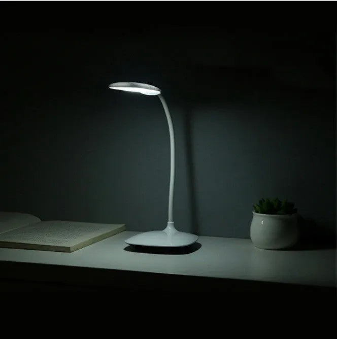 White LED desk lamp with USB charging and touch switch on a desk