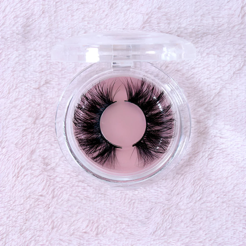 25MM3D handmade mink eyelashes in a clear plastic tray showing 25mm length 3D curl design