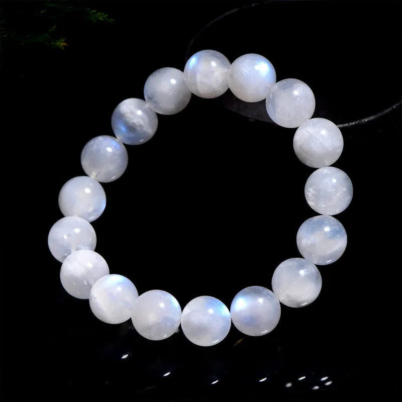 Natural blue moonlight round bead moonstone bracelet on wrist showing polished gemstone beads