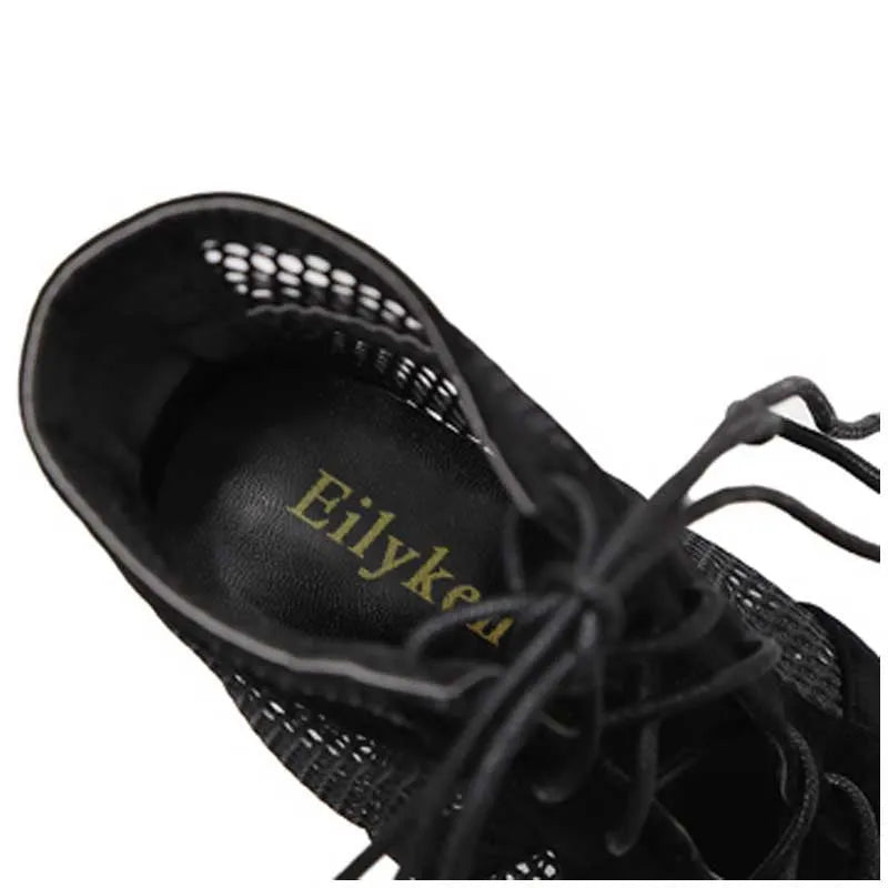 Black suede women's lace-up high heel shoes with an 11.5cm heel on a white background.