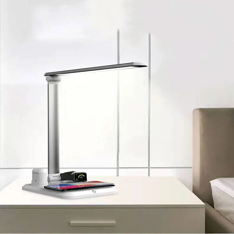 X-1 4-in-1 multi-function LED desk lamp in black or white with wireless charging pad.
