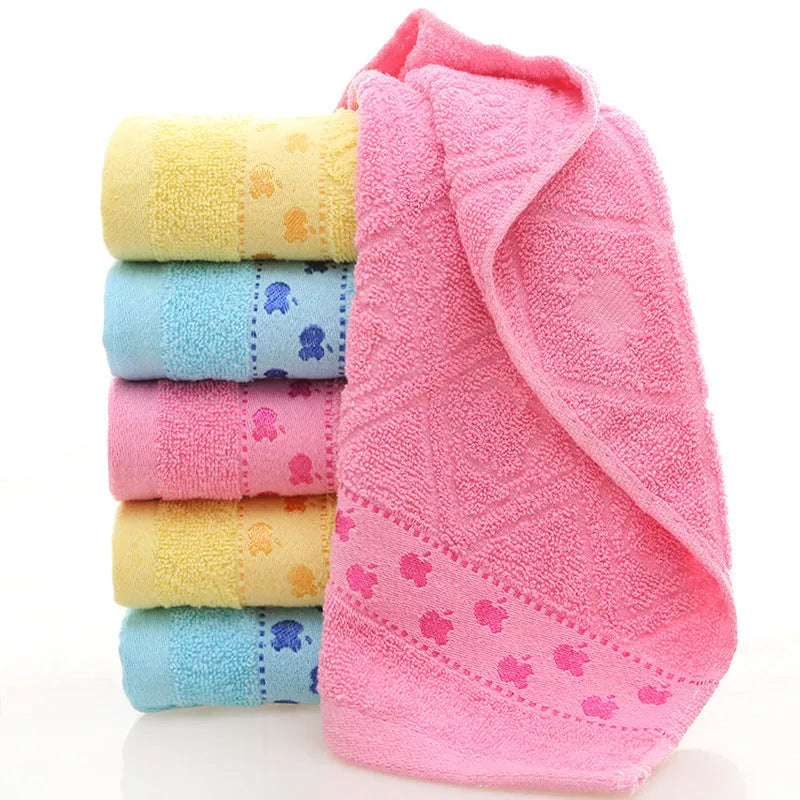 Cotton face towel 73x33cm in blue pink yellow patterns on hanger