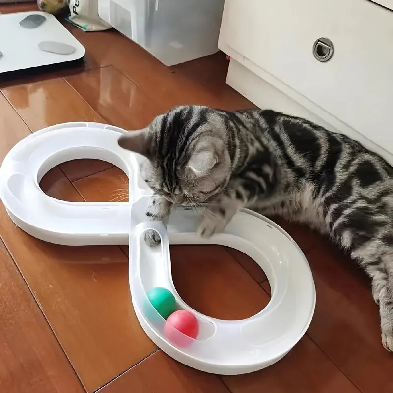 Blue and white interactive cat play station with turntable track, ball, and feather teaser stick.