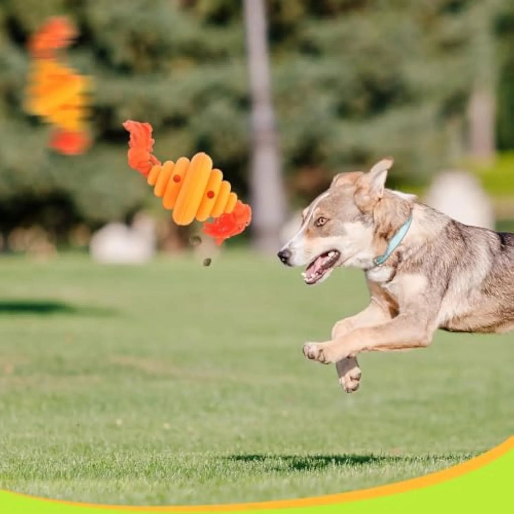 Green and yellow food-dispensing silicone dog ball with an attached rope for tug-of-war.