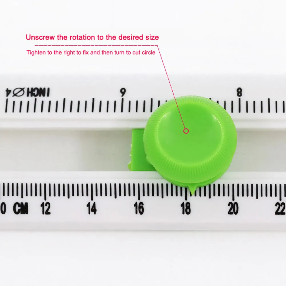Plastic round paper cutter in orange colour on green background with A3 cutting capacity