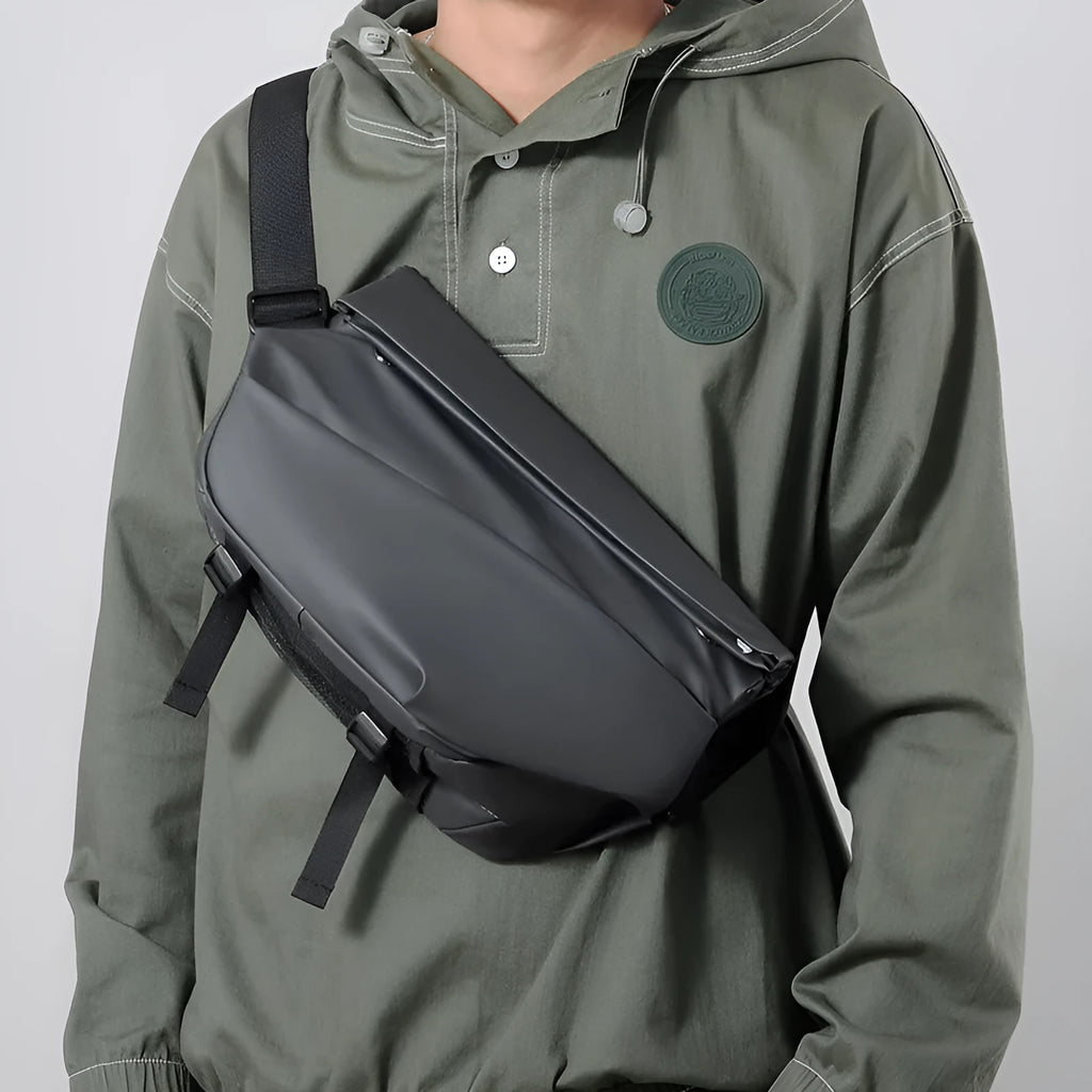 Grey medium-sized PU leather crossbody sling bag for men with a horizontal square shape.