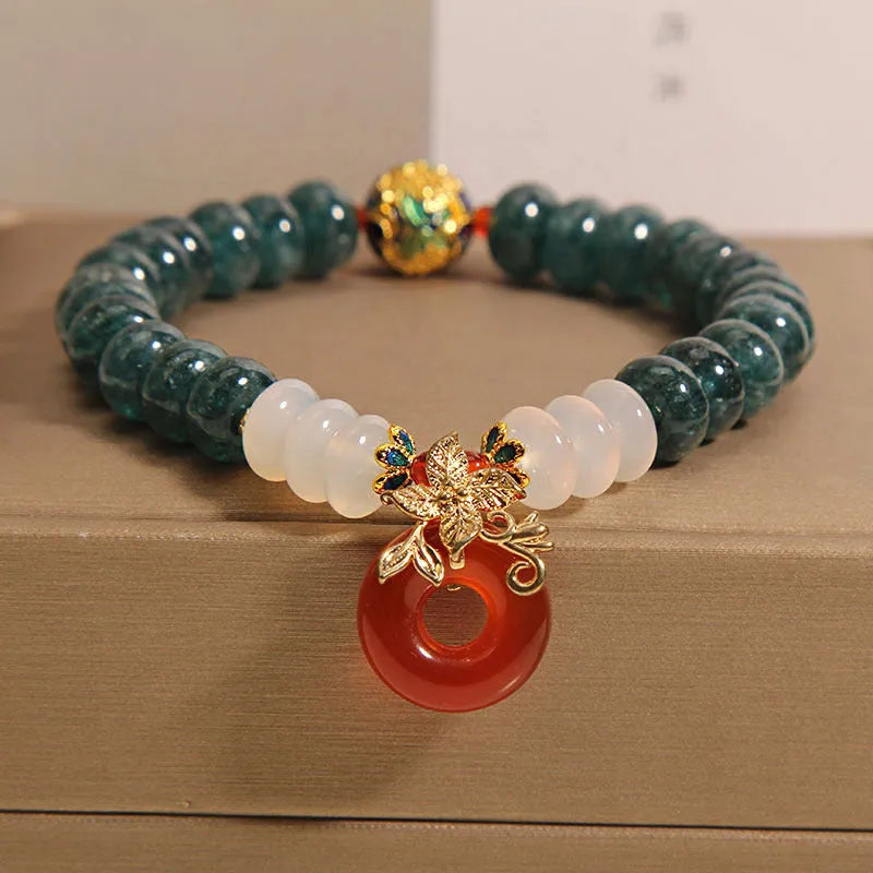 Blue water jade abacus bead crystal bracelet with red agate peace buckle and rhinestone details
