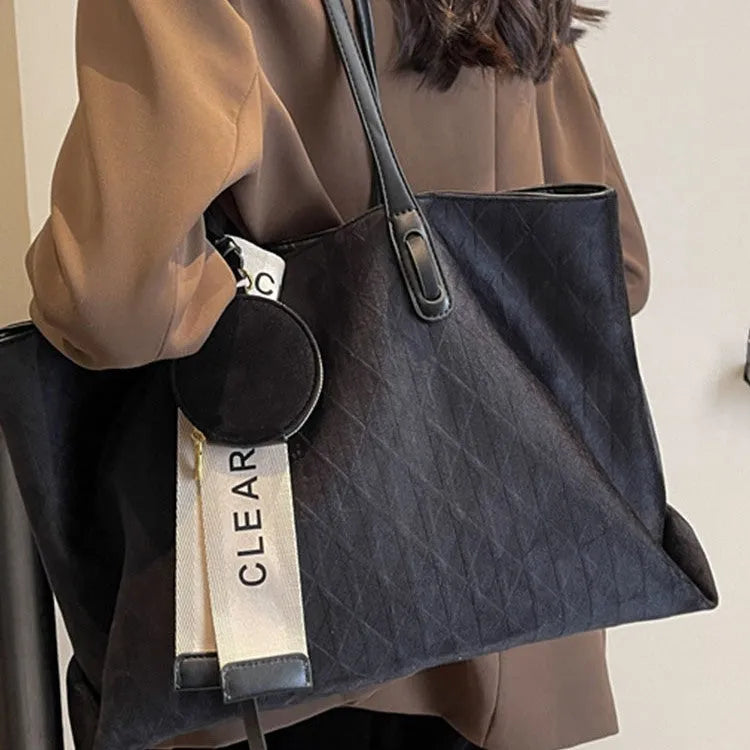 Large casual tote bag with shoulder strap in horizontal square shape with zippered internal compartment