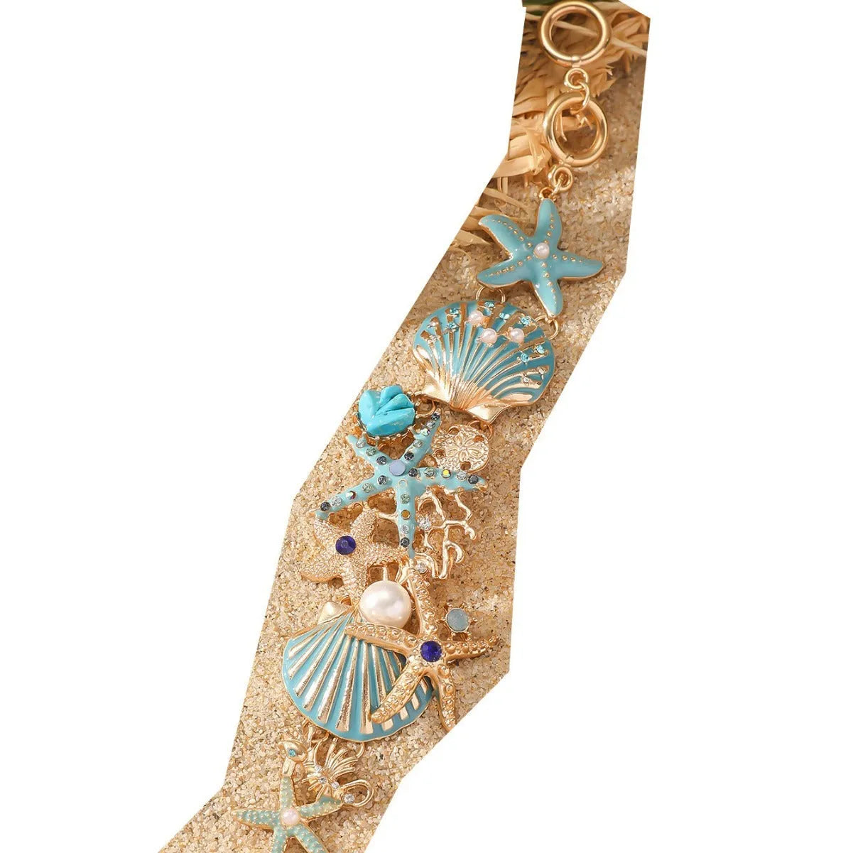 Women's alloy rhinestone bracelet with a nautical boat anchor and starfish design in blue coral colour.