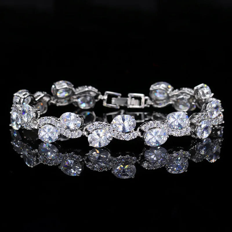 Electroplated copper bracelet with zircon stones in geometric design showing gold colour finish
