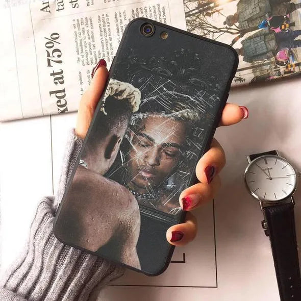 Transparent half-wrapped iPhone case with matte finish and XXXTentacion graphic design on a phone.