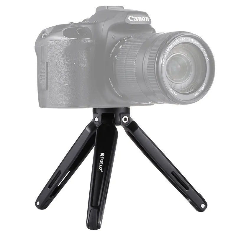 Metal mini tripod with non-slip rubber feet, 15cm max height, black, on uneven outdoor surface
