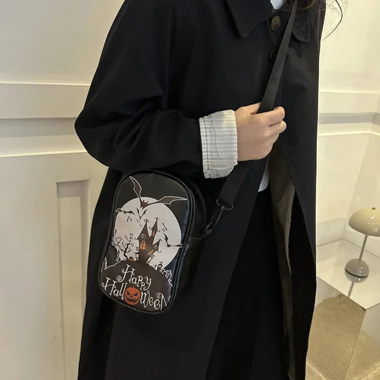 Black Halloween graffiti crossbody bag with pumpkin, ghost, and bat print