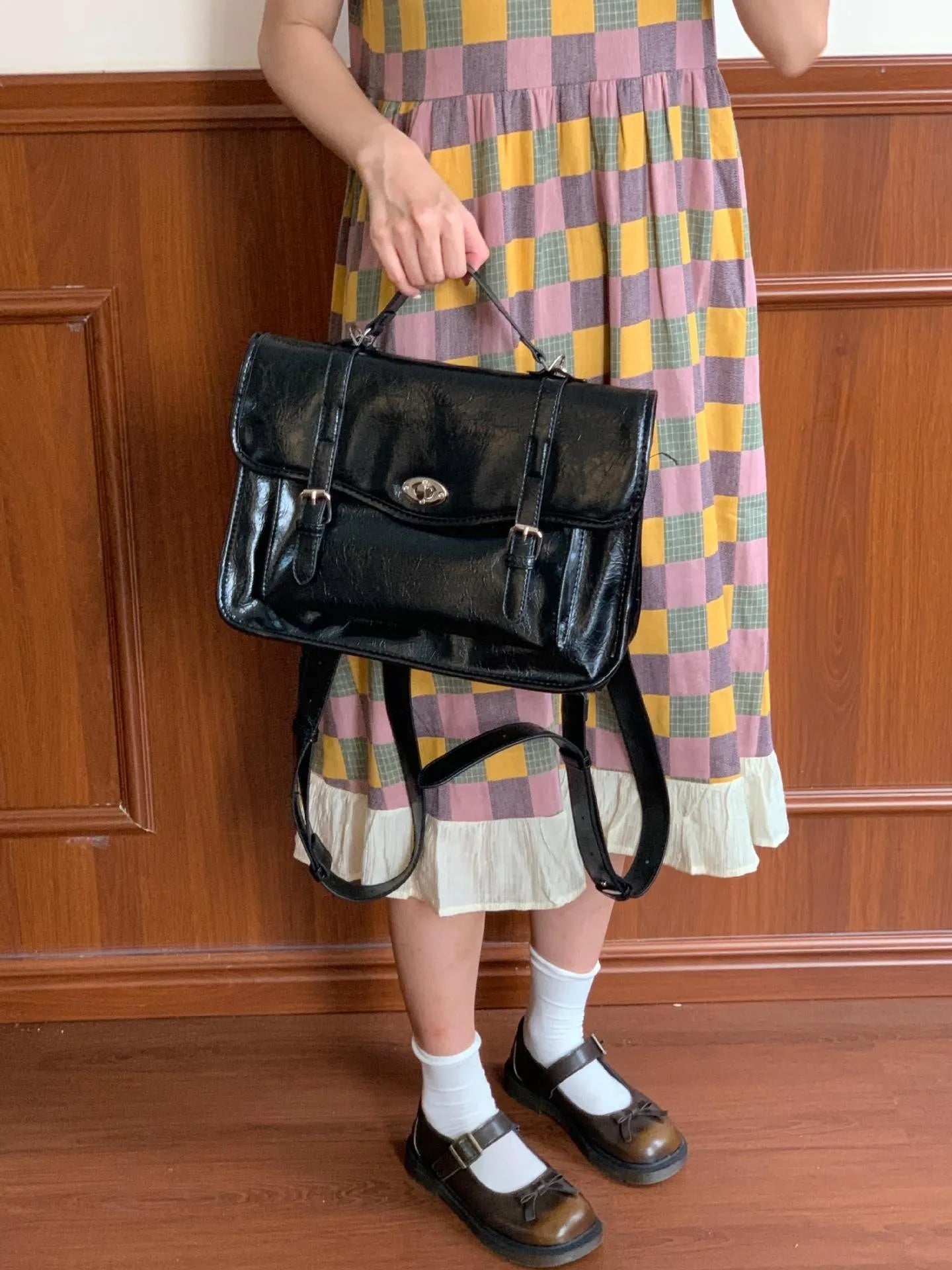 Black college style messenger bag made from oil wax PU leather showing 35cm length dimensions