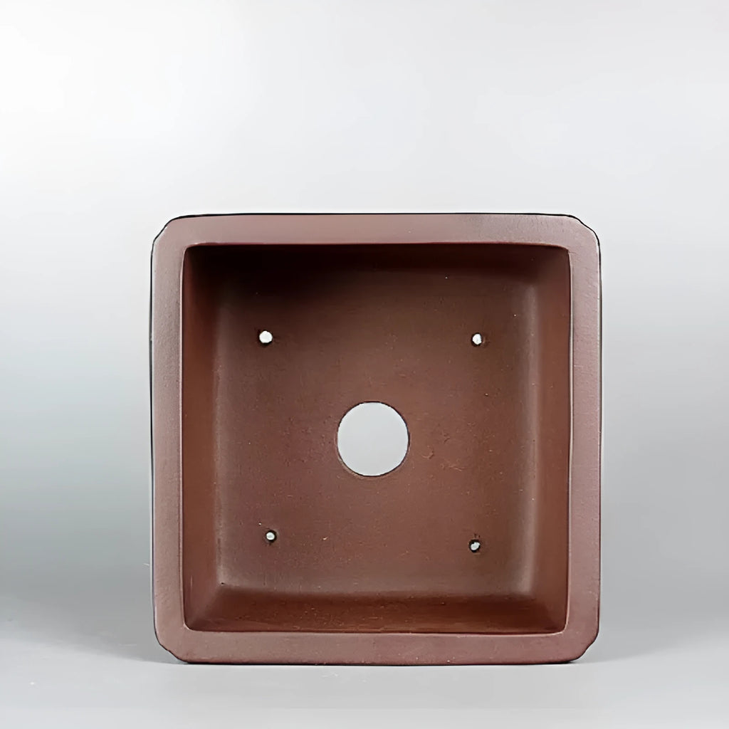 Brown handmade purple clay flower pot with antique styling and drainage hole