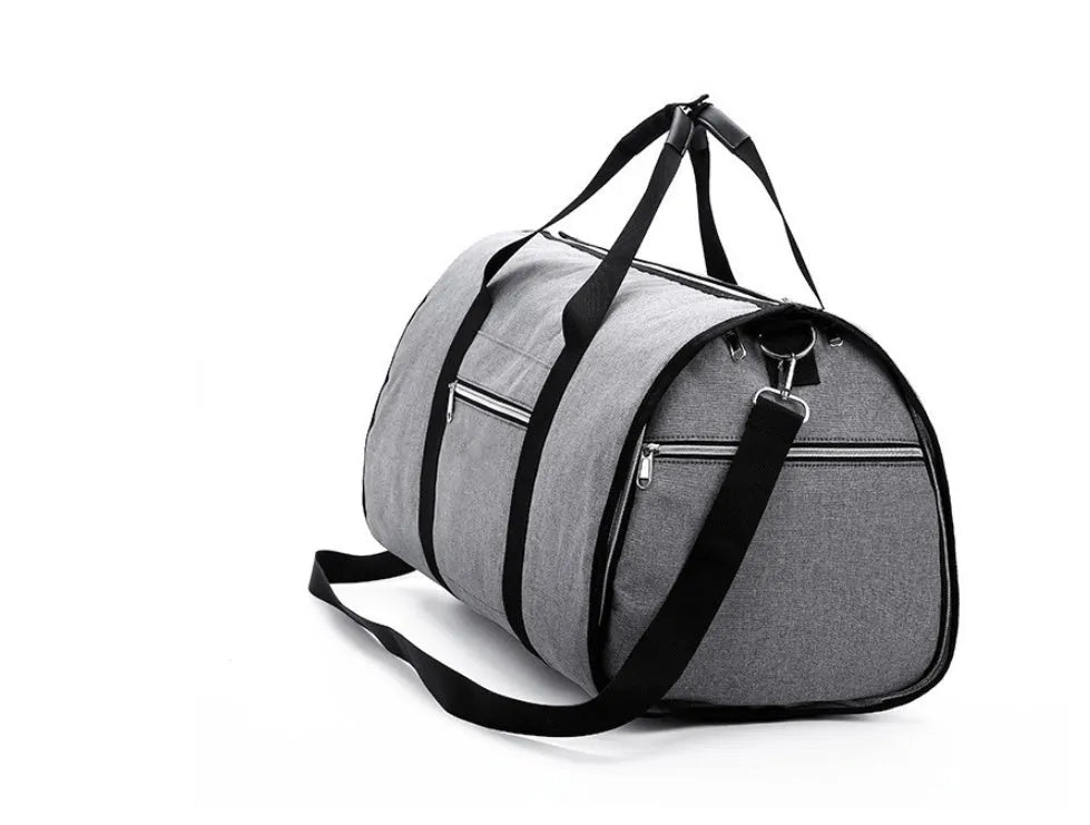 Medium cylinder travel bag in Oxford cloth, shown in black, with zipper open to reveal internal pocket.
