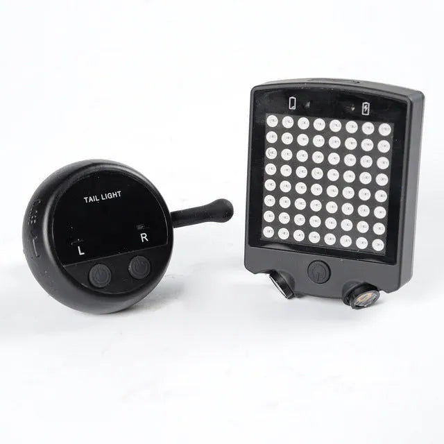 Black LED bicycle turn signal unit with dot matrix display and laser line, wireless remote control, on a bicycle seatpost
