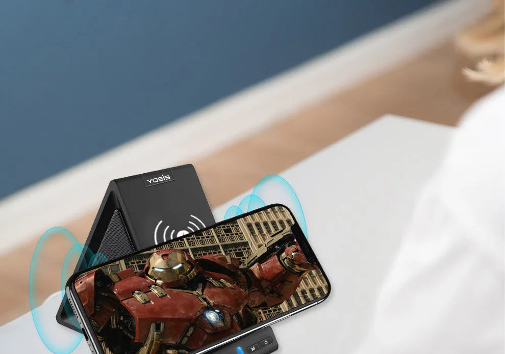Black multifunctional Bluetooth speaker with wireless charging pad, phone stand, and 2000mAh power bank