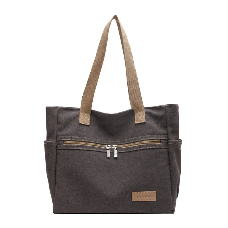 Canvas shoulder bag for women with contrast stitching and double shoulder straps, available in grey