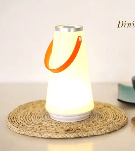 White rechargeable LED bedside lantern with USB cable, showing compact columnar design