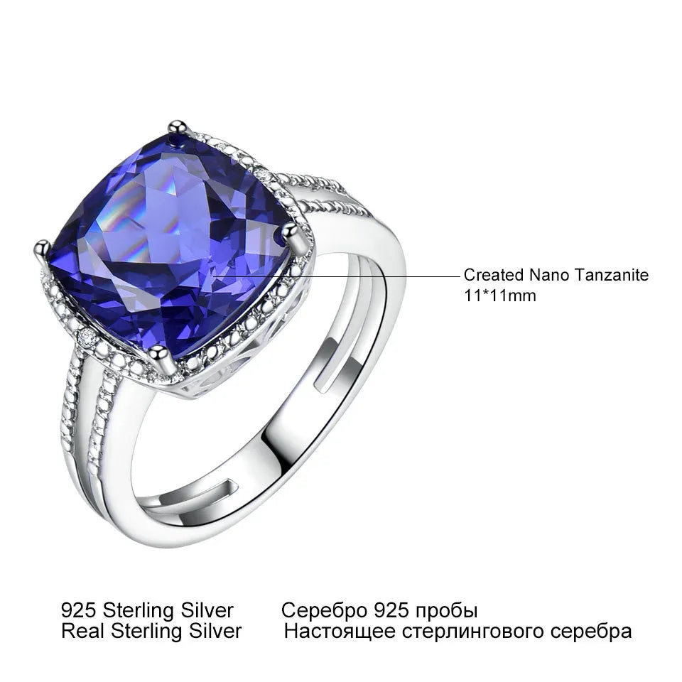 Women's sterling silver ring with blue tanzanite stone showing silver band and gemstone setting