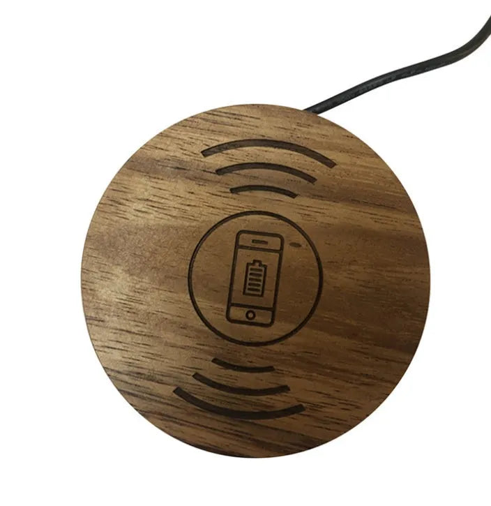 Round 60mm hidden wireless phone charger for installation in furniture.