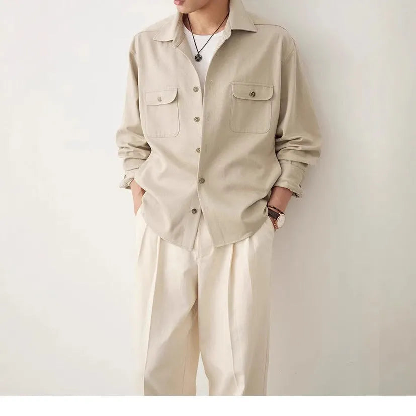 Men's long sleeve lapel shirt in light sand rice colour, showing collar detail and stitching.