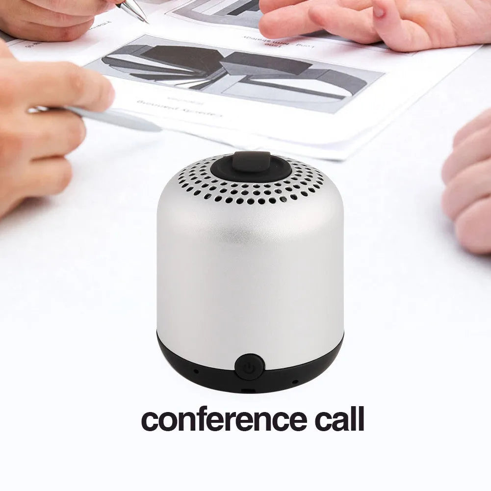 Hieha XQ11 cylinder-shaped mini portable Bluetooth speaker in metallic colour on a table.