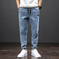 Men's cropped oversized slimming straight leg jeans in black, grey, and blue with high elasticity cotton blend