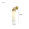 Modern minimalist glass wall lamp with an E27 holder in a choice of light colours on a living room wall.