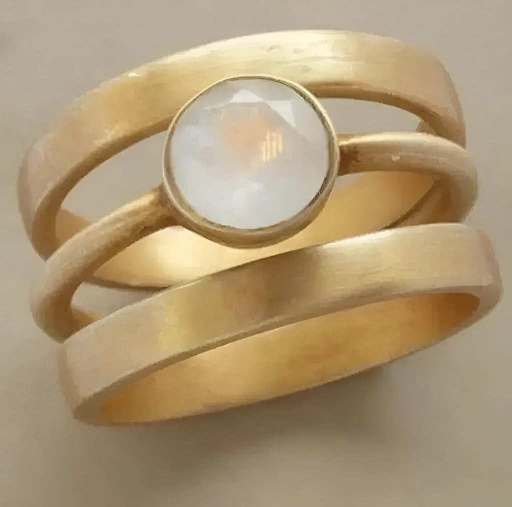 Gold plated titanium steel geometric ring with white chalcedony stone in micro-inlaid setting