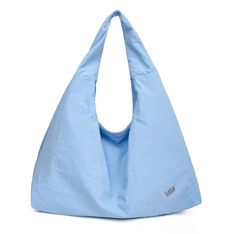 Women's soft nylon underarm bag in a heart shape, shown in black, blue, khaki, and yellow colour options.