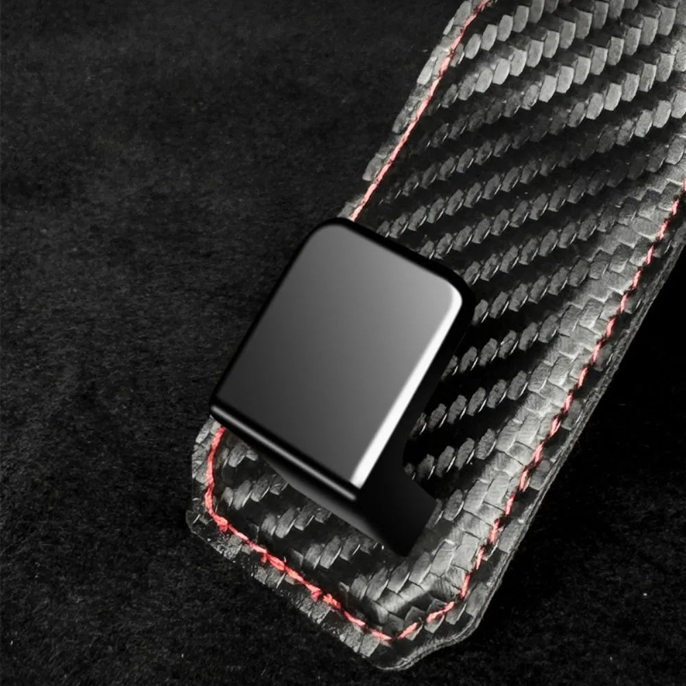 Black carbon fibre metal car hook clipped to headrest with 25kg load capacity