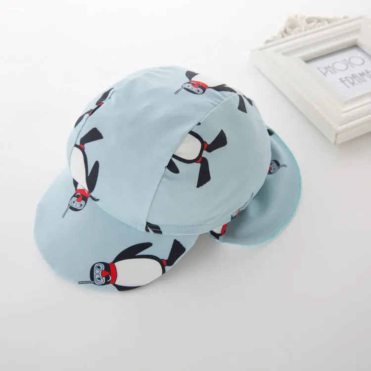 Boys' penguin print long sleeve one-piece swimsuit with matching swimming cap
