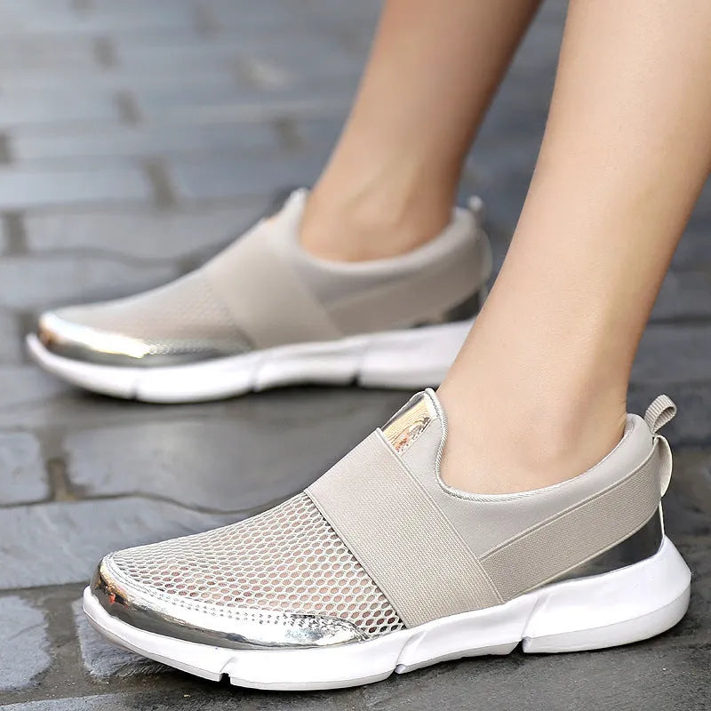 Blue, black, and grey low-top women's casual sneakers with mesh interior and PU midsole.