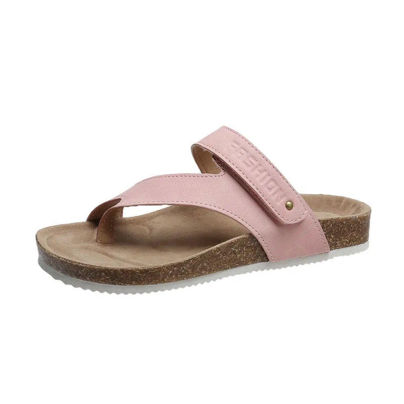 Flat toe ring thick-soled flip-flop in a solid colour on a plain background