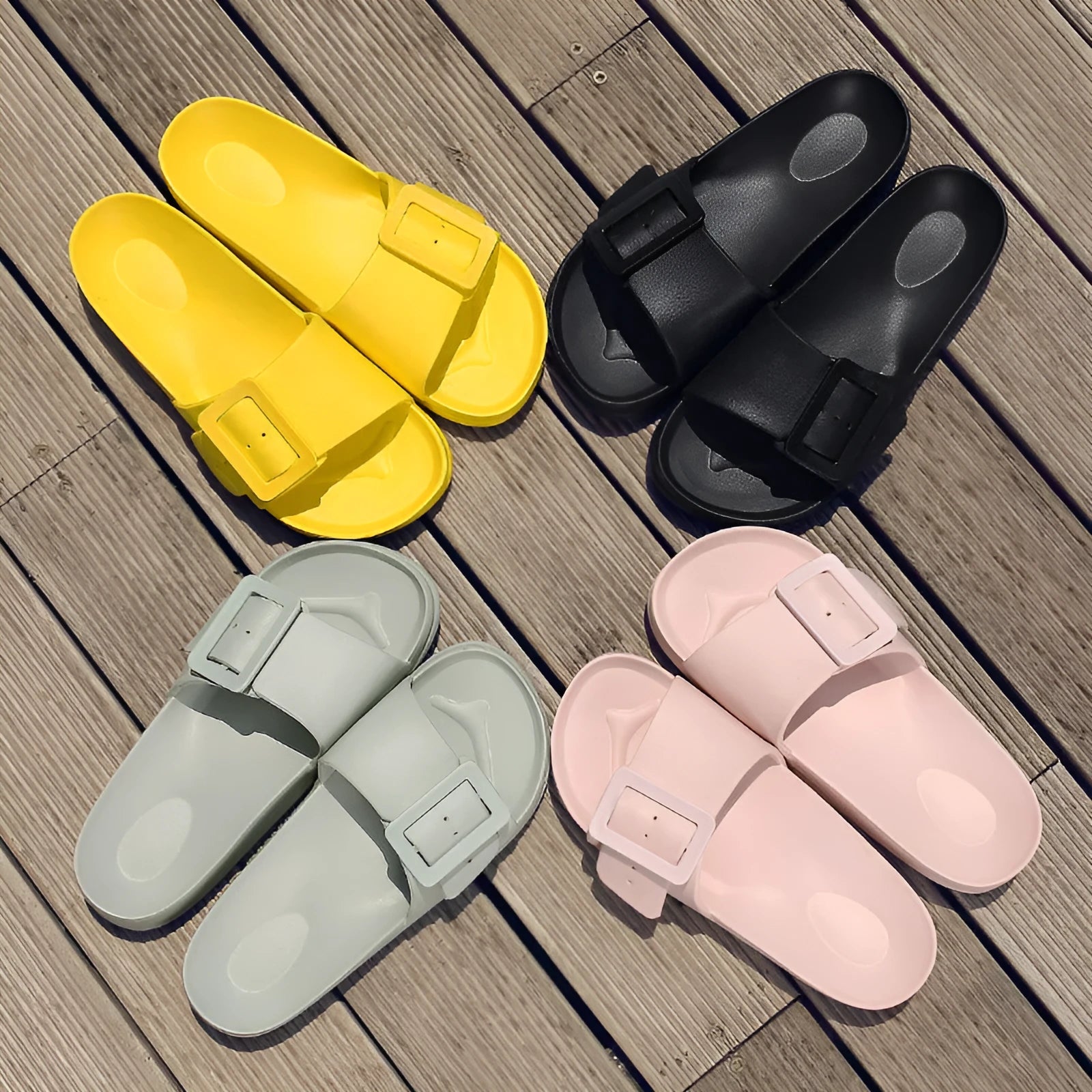 Women's grey blue buckle fastening flip-flop sandals with a soft EVA sole on a white background.
