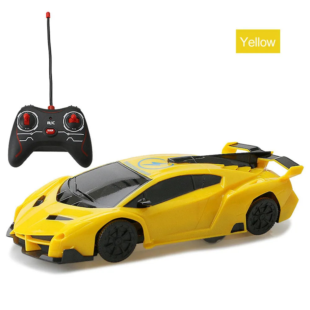 Remote control wall climbing car in red with industrial fan vents and white adsorbent strip on bottom, 1/28 scale