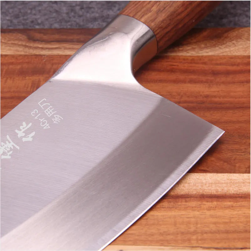 Stainless steel kitchen knife with 19.8cm blade, 60 degree edge, and yellow wooden handle on a cutting board
