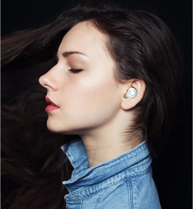Black and white M18 true wireless in-ear stereo headphones with Bluetooth 5.0 shown with charging case