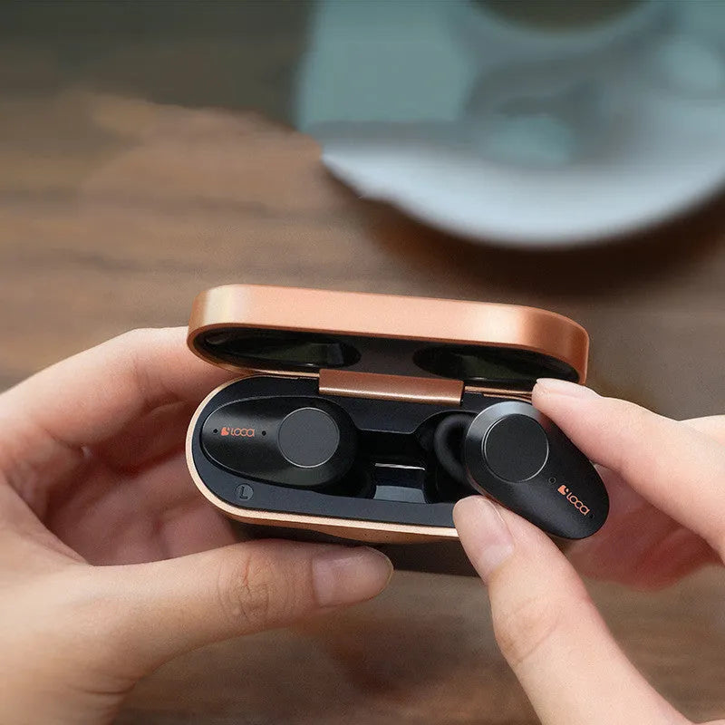 Black wireless Bluetooth stereo headset with charging stand