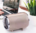 Portable plug-in subwoofer with metal casing in choice of five colours, showing button controls.