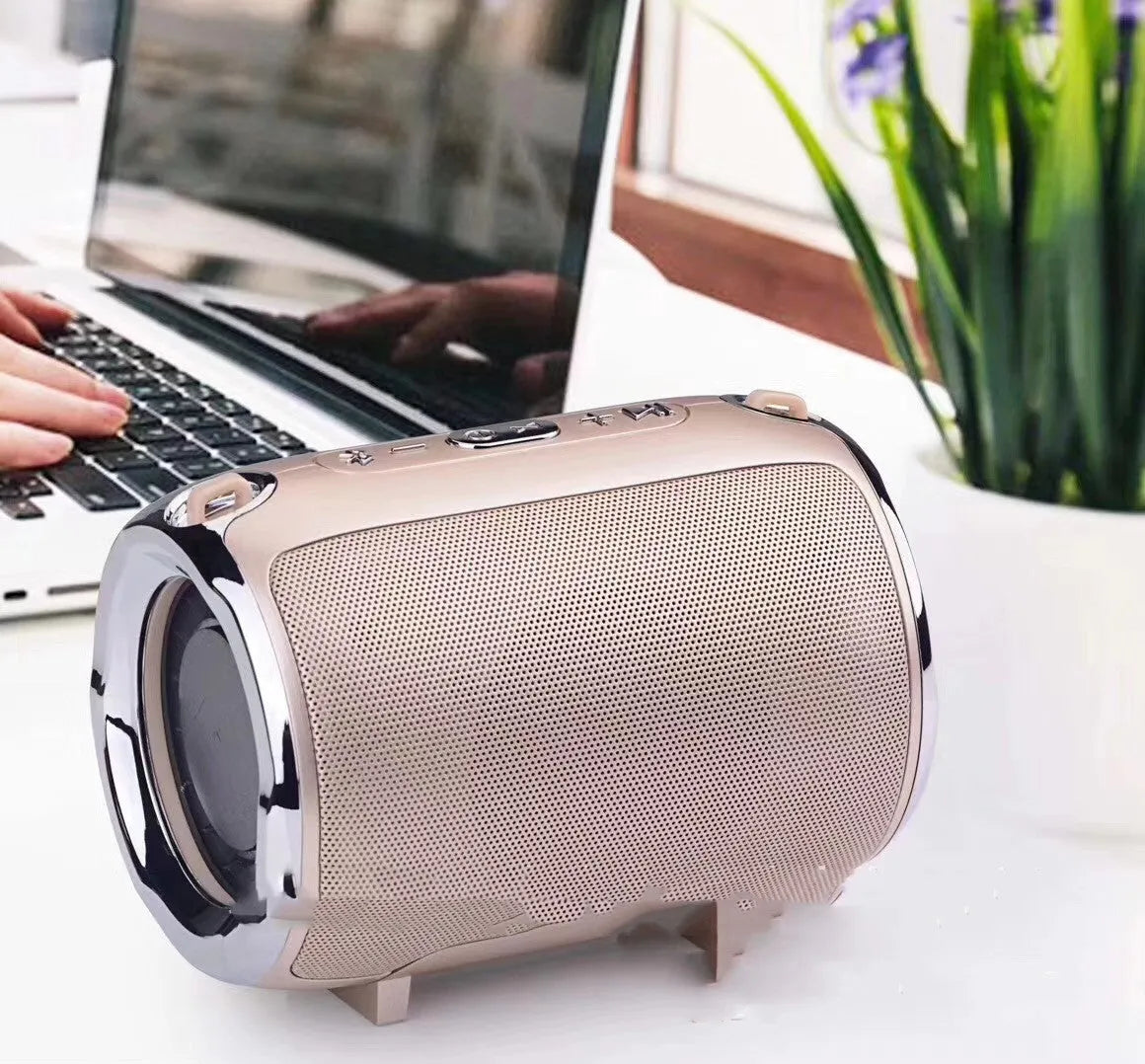 Portable plug-in subwoofer with metal casing in choice of five colours, showing button controls.