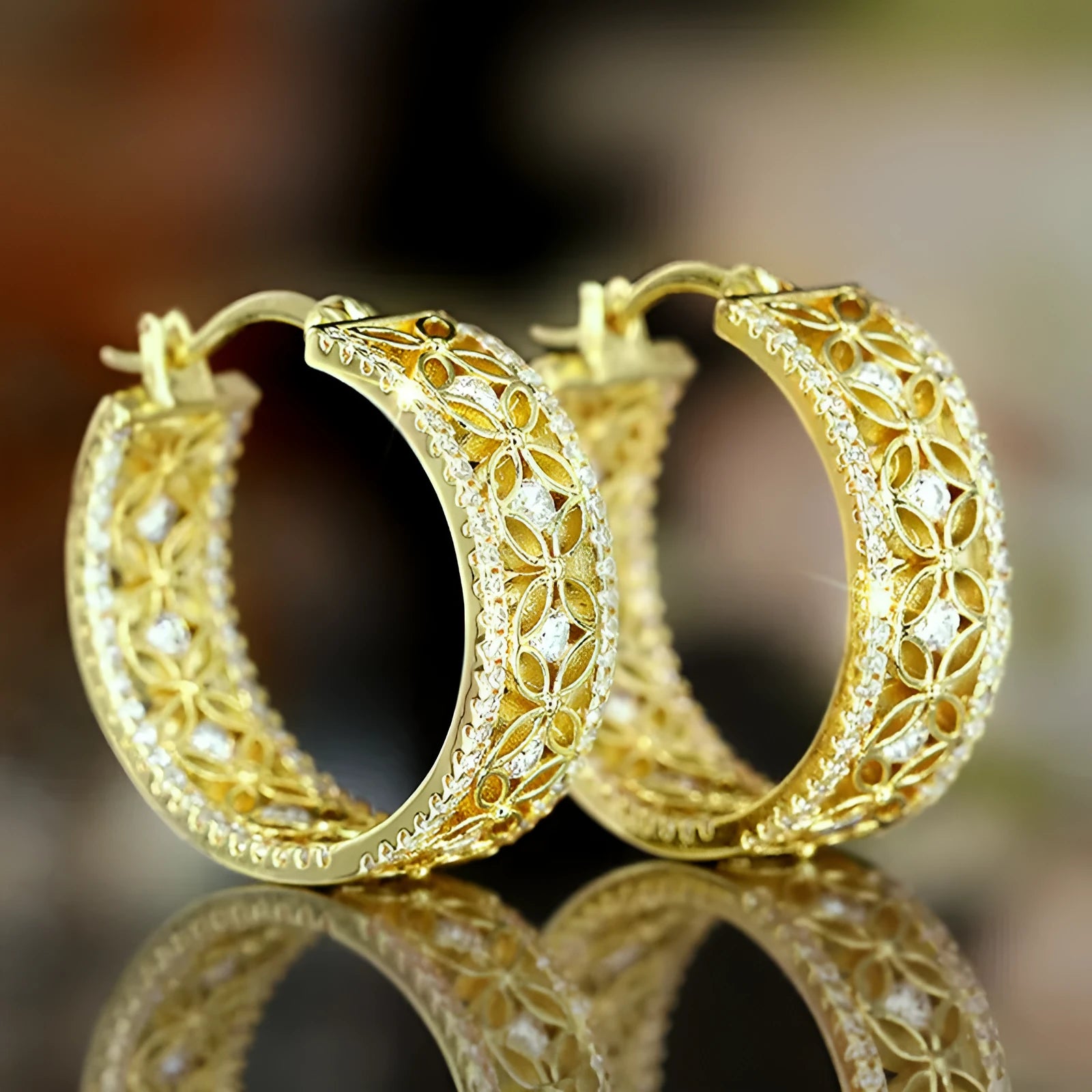 Copper geometric ear clips with horse eye flower butterfly motifs in yellow gold colour