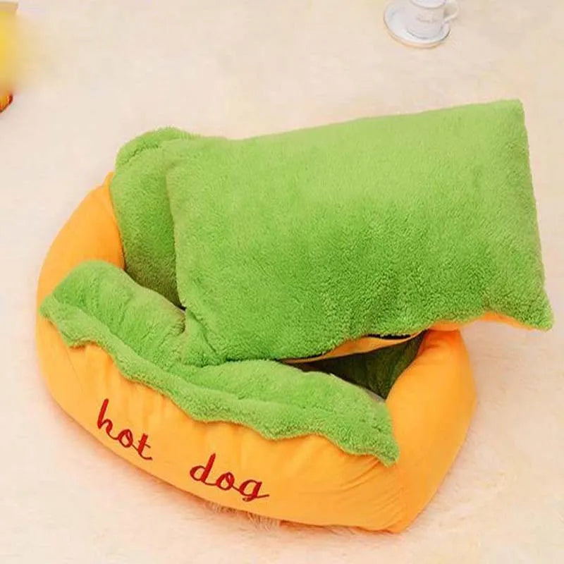Grey hot dog style pet bed with high sides, a removable centre mat, and an anti-slip fabric base.