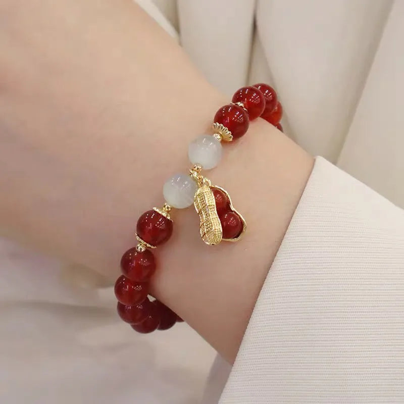 Chinese style glass bracelet with bamboo joint details in a red Lvzhu Duobao design.